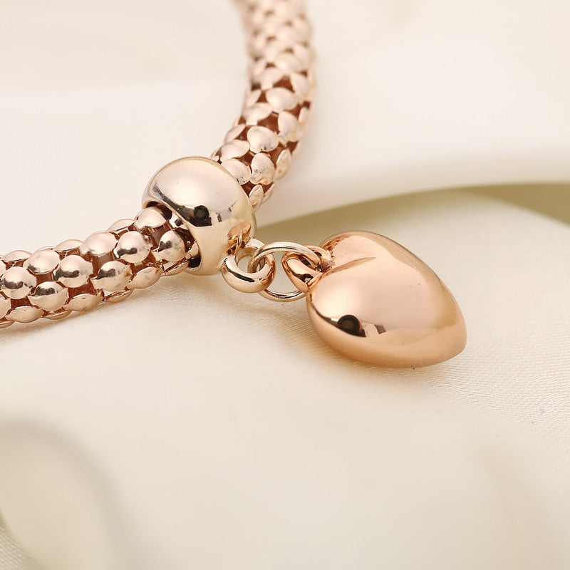 Aria – Bracelet en métal avec cœurs solides