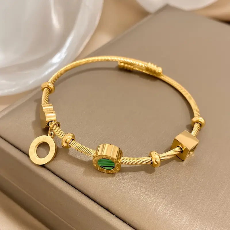 Rhian – Bracelet doré de signature