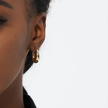Boucles d'oreilles ouvertes épaisses au design moderne