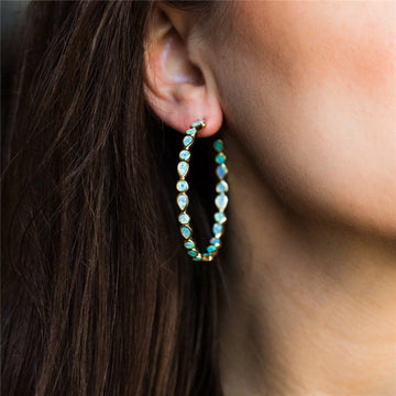 Élégance lumineuse - Boucles d'oreilles en opale bleue et or