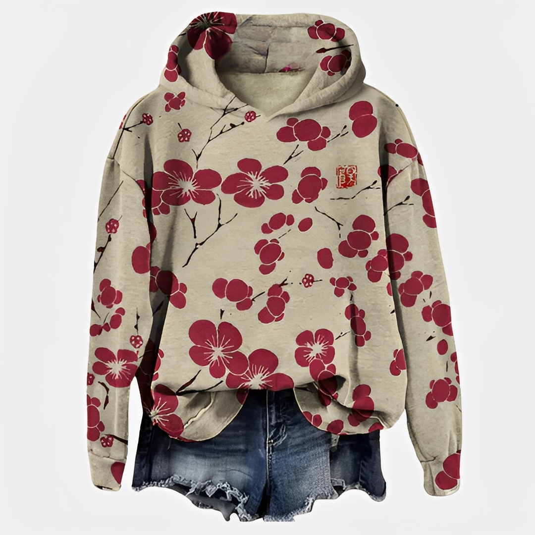 Emelyn - Un pull à capuche avec motif floral pour femmes