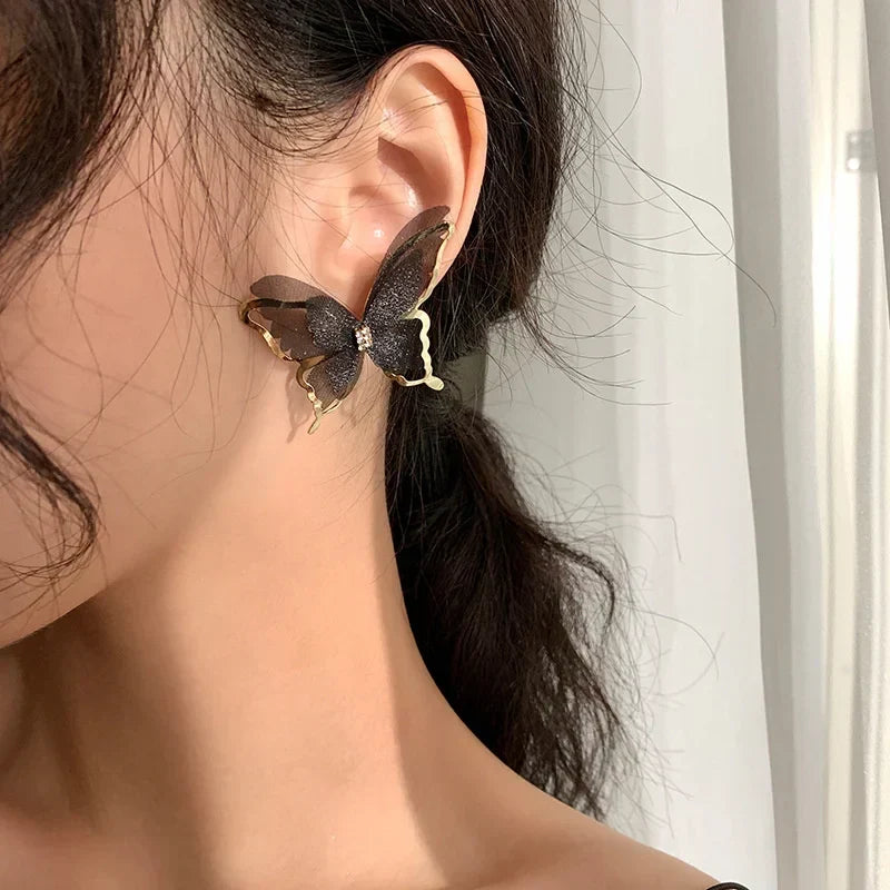 Jean – Boucles d'oreilles papillon en tressage léger