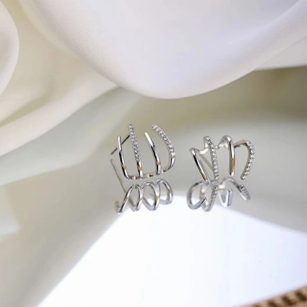 Boucles d'oreilles Huggie en zircon à quatre pointes
