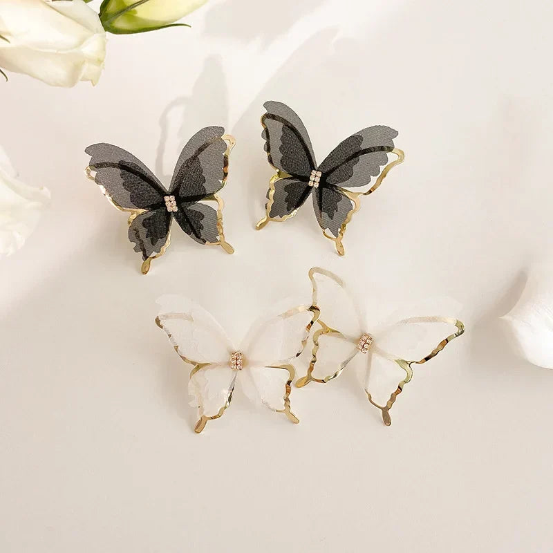 Jean – Boucles d'oreilles papillon en tressage léger