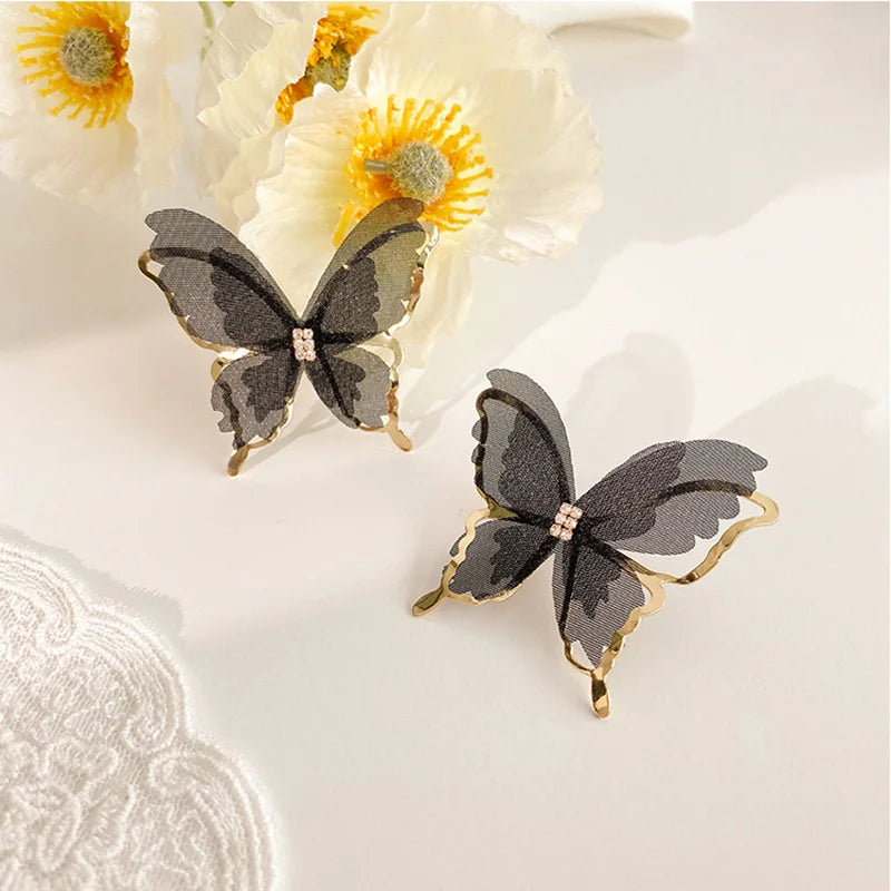 Jean – Boucles d'oreilles papillon en tressage léger