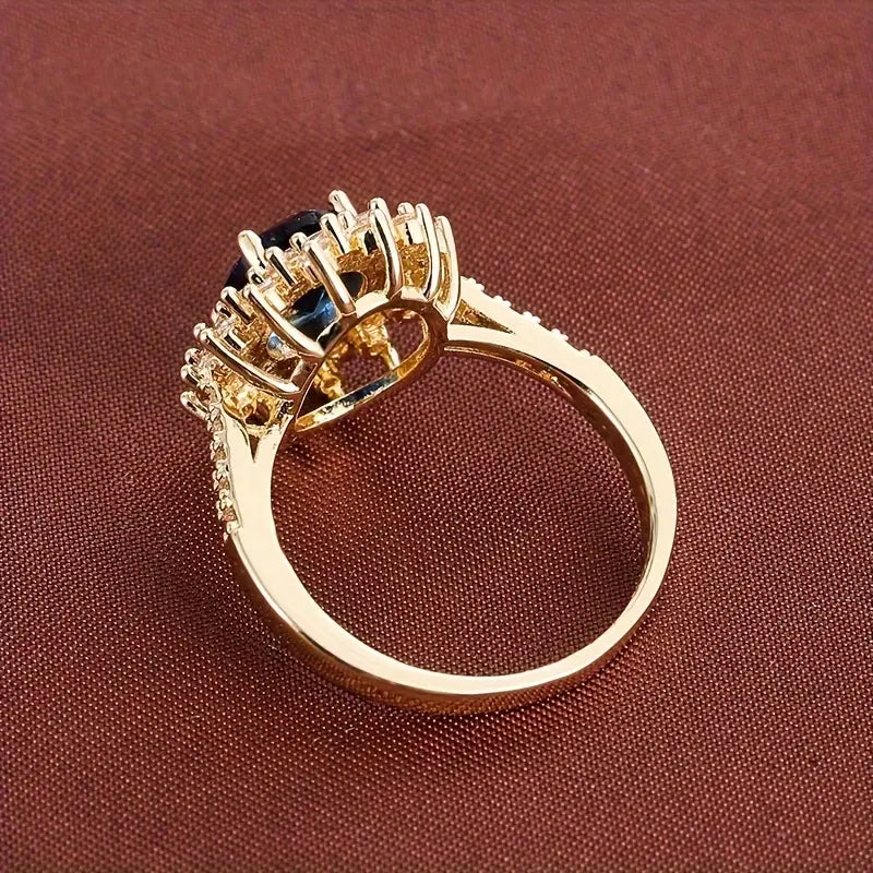Delphine – Bague Chic dorée avec pierre bleue