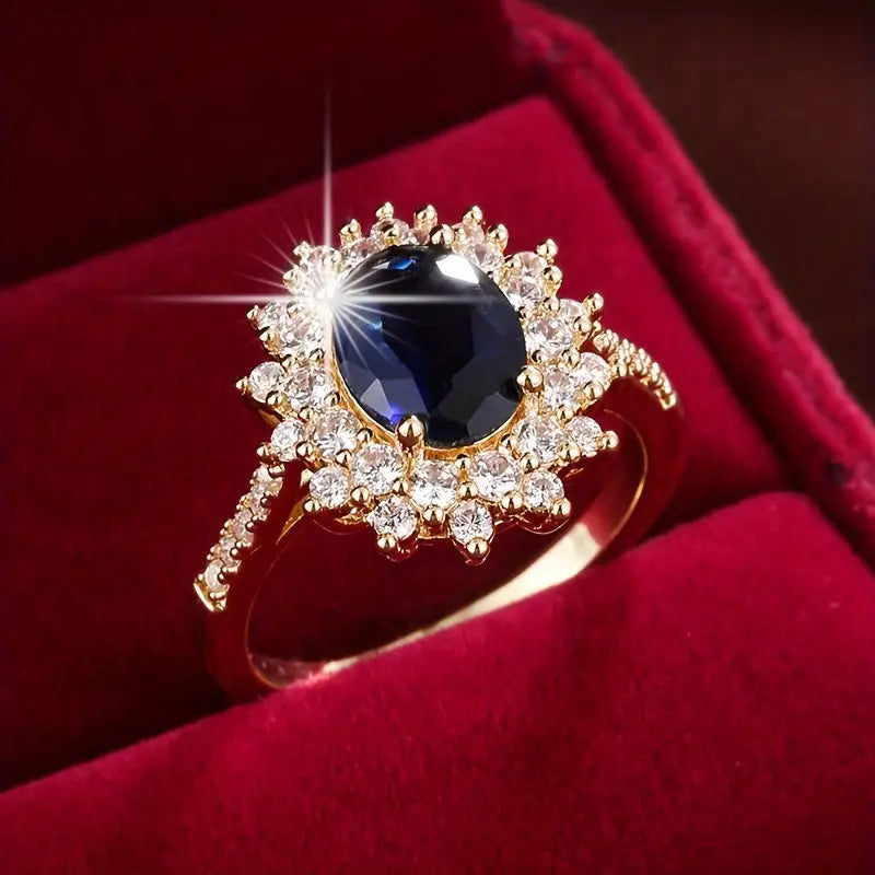 Delphine – Bague Chic dorée avec pierre bleue