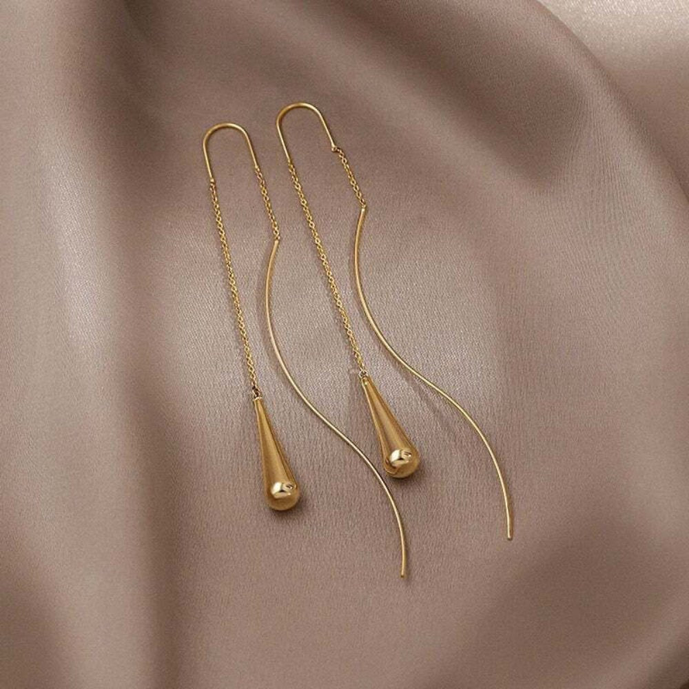 Amaris – Boucles d'oreilles gouttes d'or avec pompons