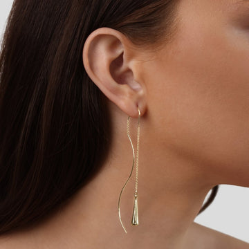 Amaris – Boucles d'oreilles gouttes d'or avec pompons