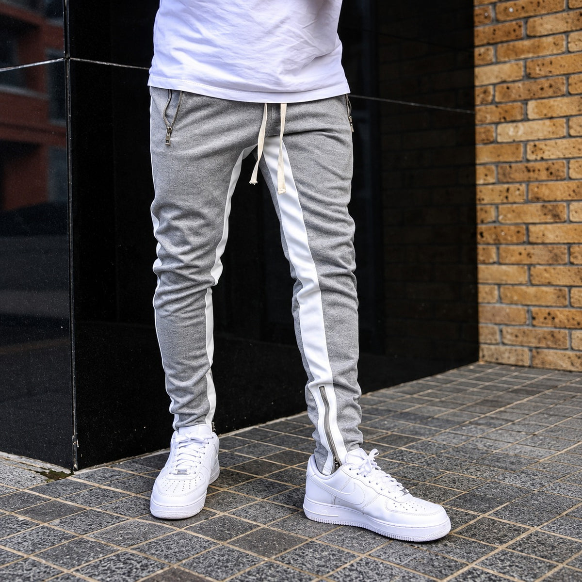 Pantalon jogging homme à rayures contrastantes et poches zippées