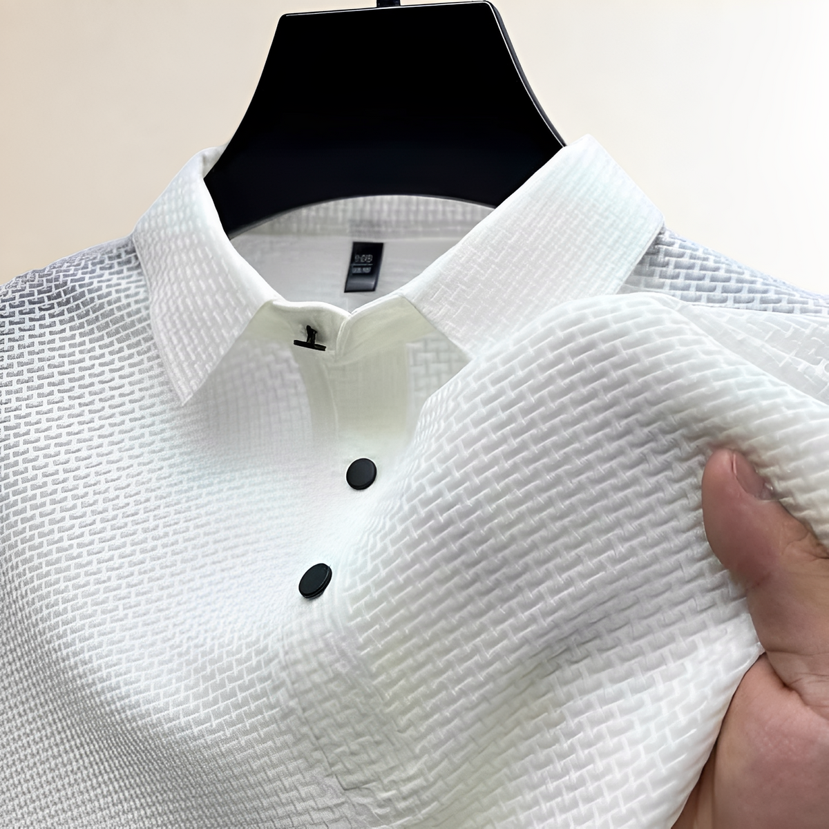 Polo homme à texture panier, col espalier, patte à pressions et coupe classique