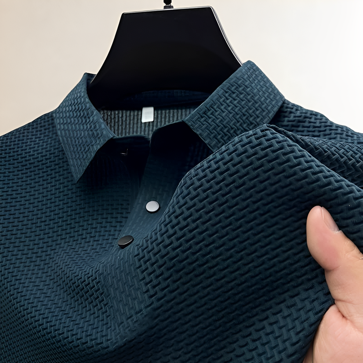 Polo homme à texture panier, col espalier, patte à pressions et coupe classique