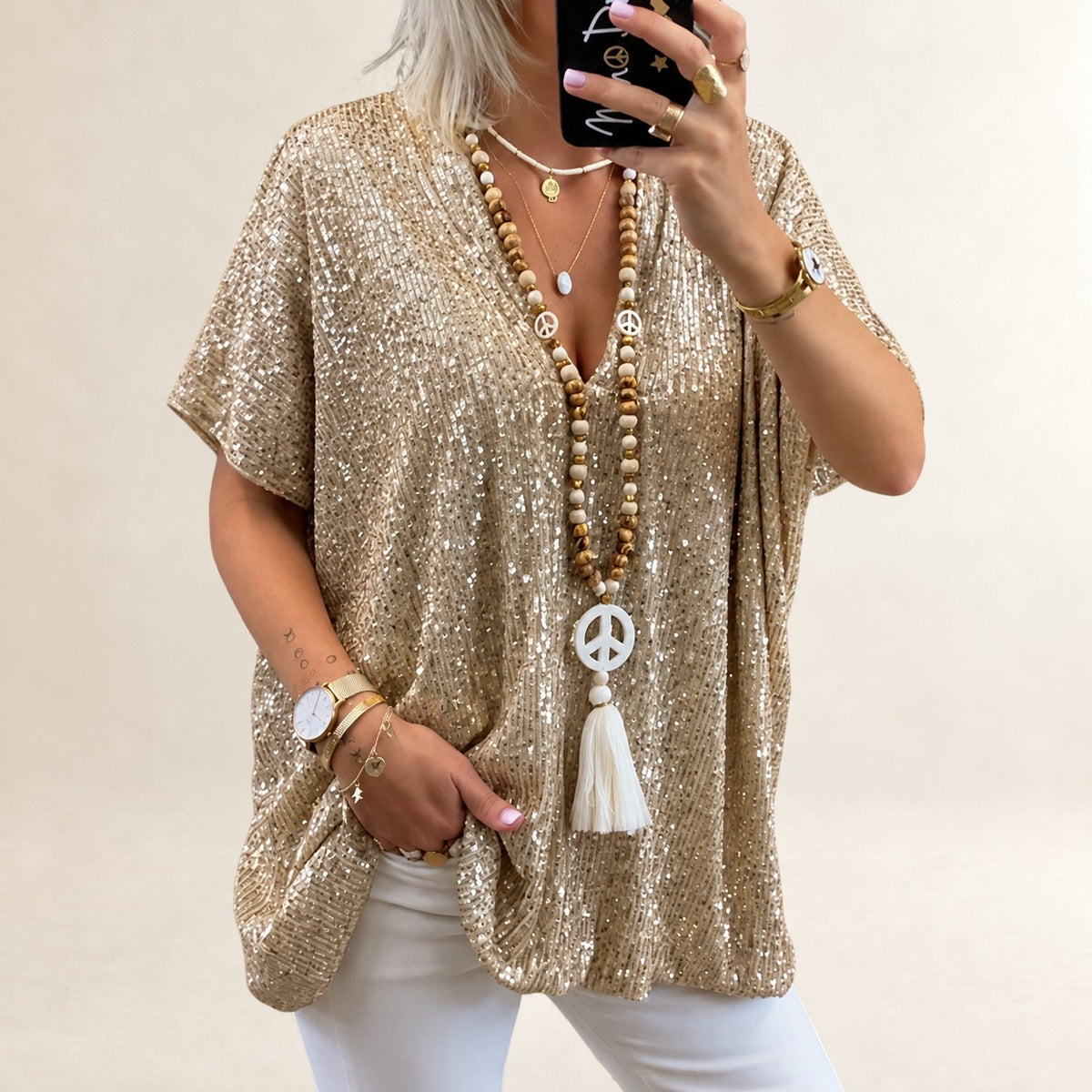 Top femme à encolure en V, manches courtes, coupe ample et longueur hip