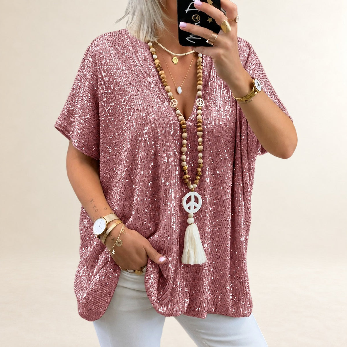 Top femme à encolure en V, manches courtes, coupe ample et longueur hip