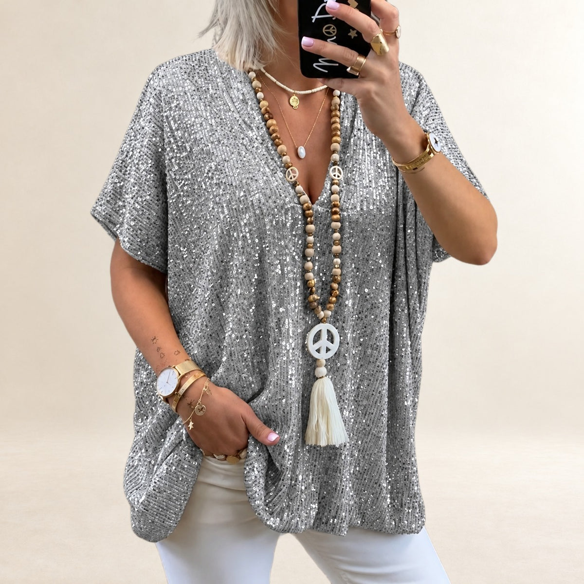 Top femme à encolure en V, manches courtes, coupe ample et longueur hip