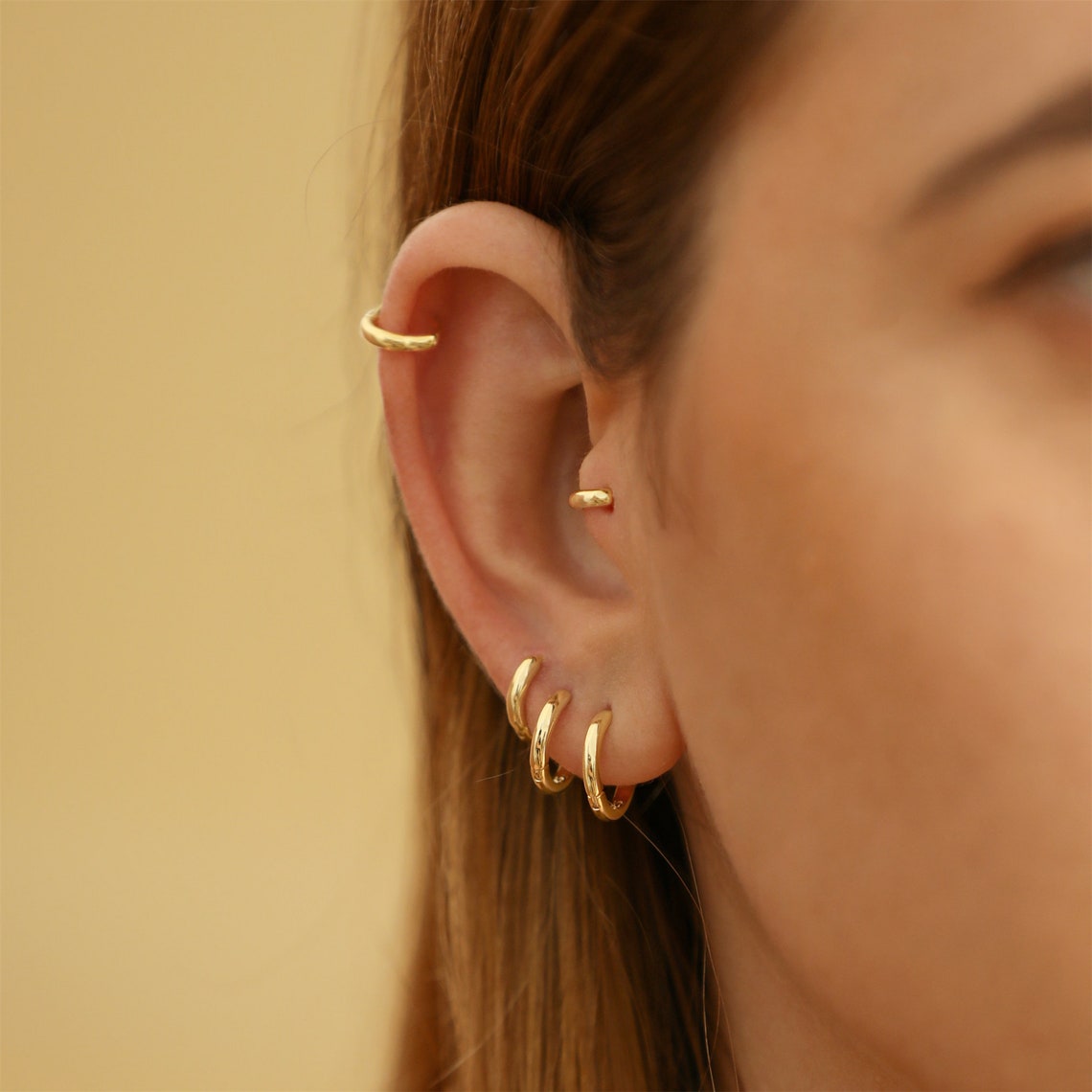 Boucles d'oreilles Huggie en or - 7 pièces d'anneaux