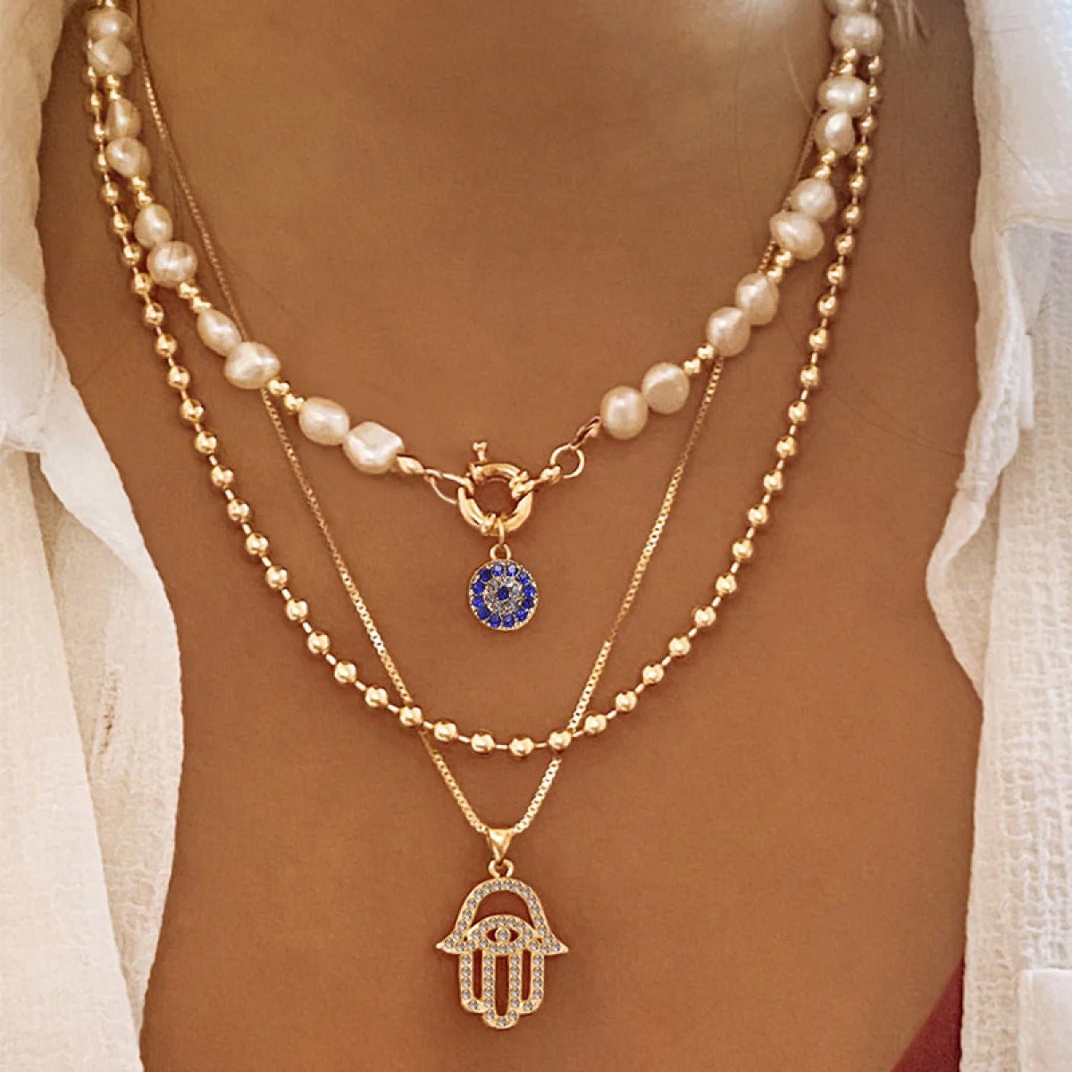 Jade – Collier en perles à plusieurs niveaux et Hamsa