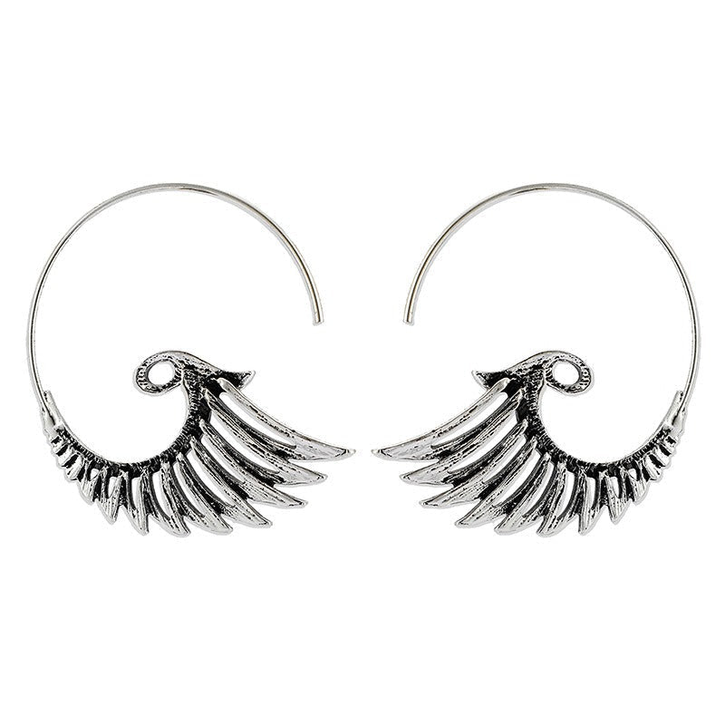 Zia – Boucles d'oreilles dorées avec design d'ailes