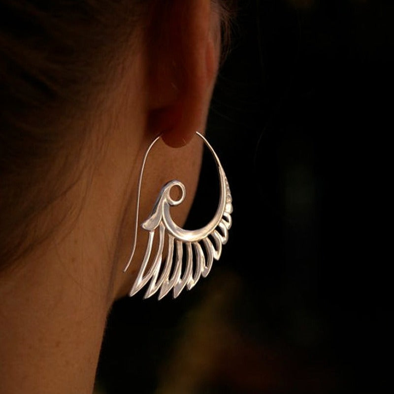 Zia – Boucles d'oreilles dorées avec design d'ailes