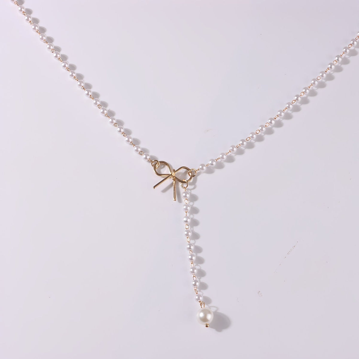 Antoneth – Collier avec pendentif nœud avec perle