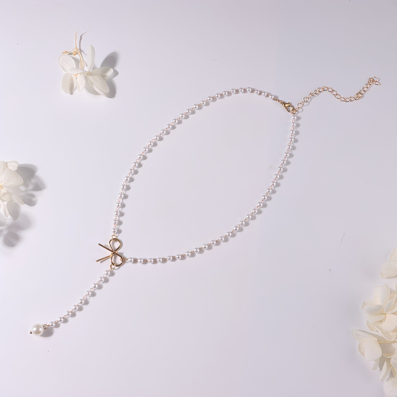 Antoneth – Collier avec pendentif nœud avec perle