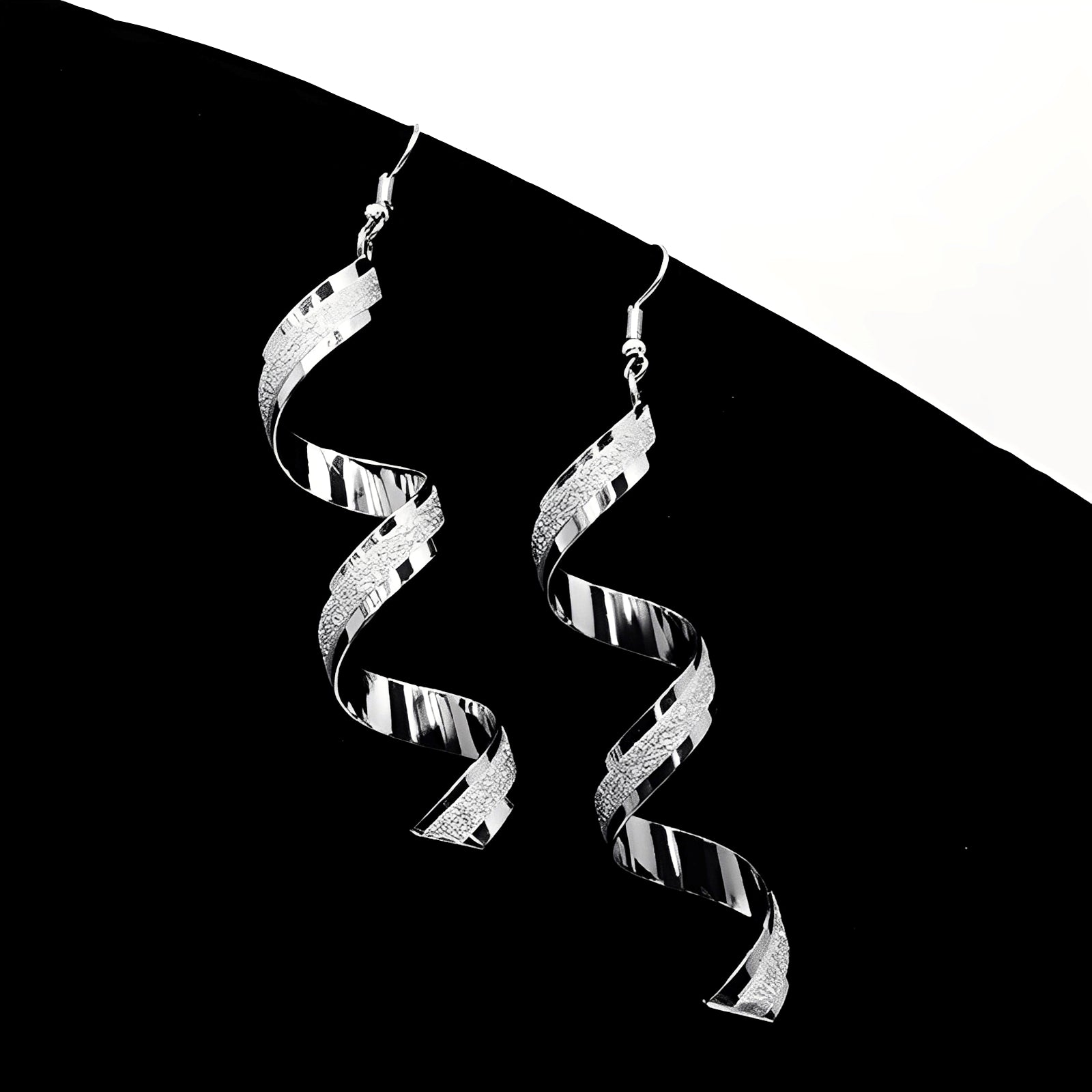 Jia – Boucles d'oreilles spirales en argent brillantes